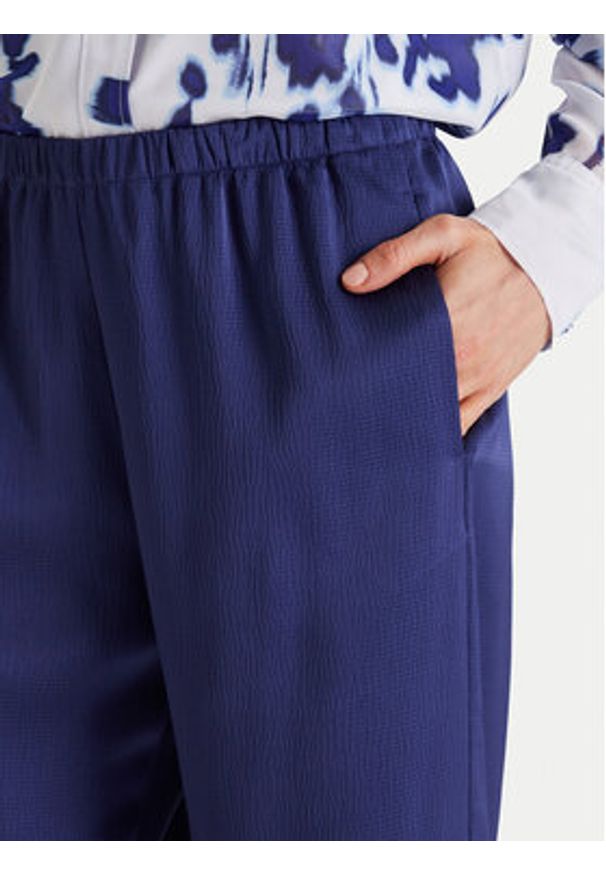 Calvin Klein Spodnie materiałowe LV044F611G Granatowy Regular Fit. Kolor: niebieski. Materiał: syntetyk