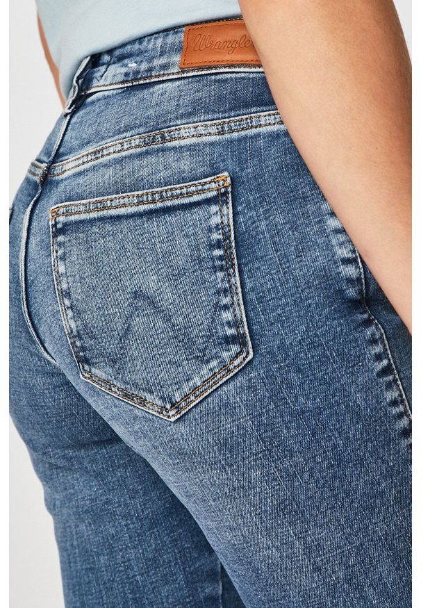 Wrangler - Jeansy. Kolor: niebieski. Wzór: aplikacja
