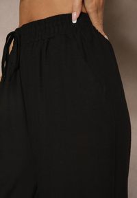 Renee - Czarne Szerokie Spodnie Palazzo High Waist z Ozdobnym Wiązaniem Arandiel. Okazja: na co dzień. Stan: podwyższony. Kolor: czarny. Materiał: jedwab. Styl: wizytowy, casual, street #4