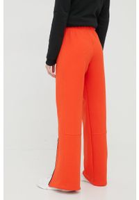Adidas by Stella McCartney - adidas by Stella McCartney spodnie dresowe H59285 damskie kolor pomarańczowy z nadrukiem. Kolor: pomarańczowy. Materiał: dresówka. Wzór: nadruk #3