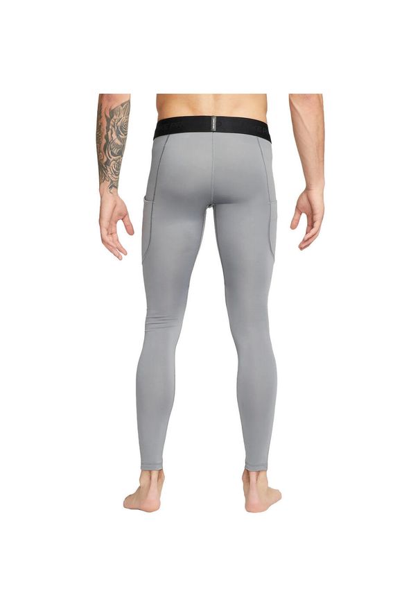 Legginsy męskie Nike Dri-FIT Fitness Tights. Kolor: szary. Materiał: poliester, materiał. Technologia: Dri-Fit (Nike). Sport: fitness