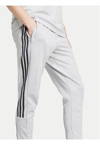 Adidas - adidas Spodnie dresowe Tiro IY4288 Szary Regular Fit. Kolor: szary. Materiał: bawełna