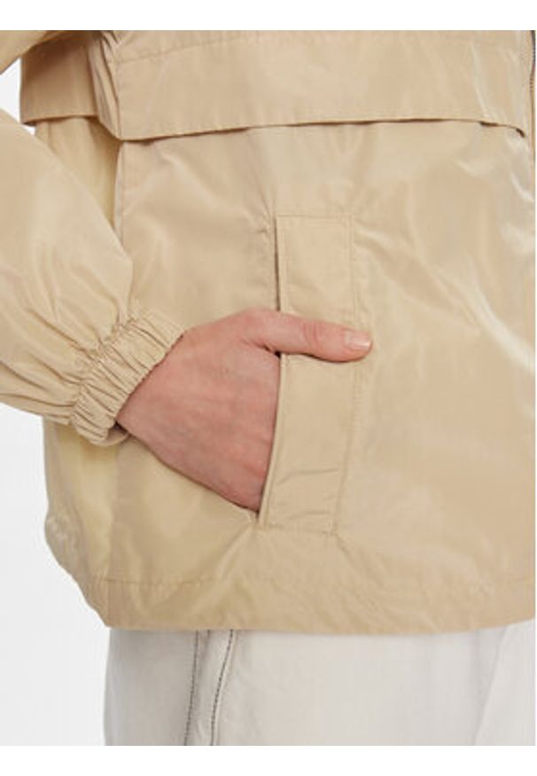 TOMMY HILFIGER - Tommy Hilfiger Wiatrówka Transitional WW0WW41790 Beżowy Regular Fit. Kolor: beżowy. Materiał: syntetyk