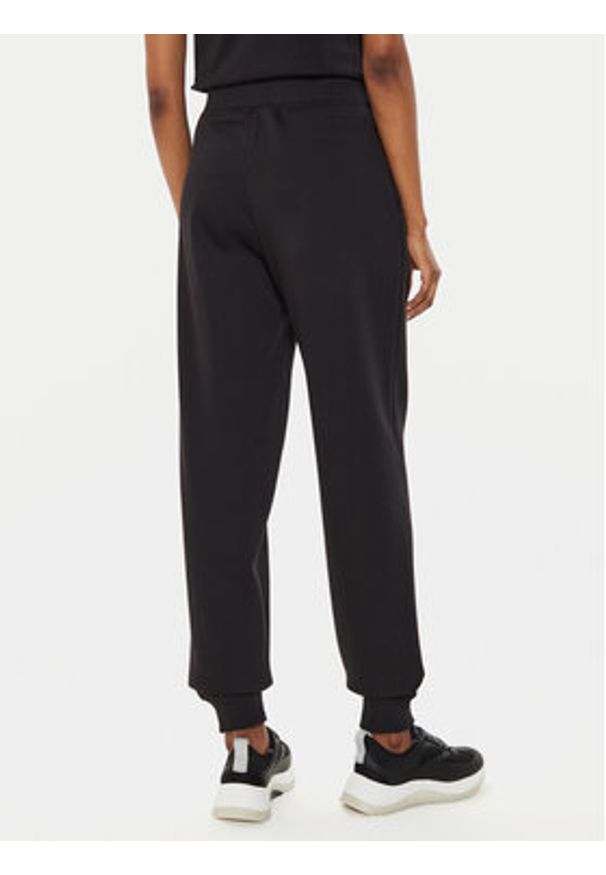 Calvin Klein Jeans Spodnie dresowe Monologo J20J223590 Czarny Relaxed Fit. Kolor: czarny. Materiał: bawełna