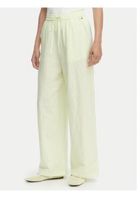 Tommy Jeans Spodnie materiałowe DW0DW22285 Zielony jasny Loose Fit. Kolor: zielony. Materiał: len #1