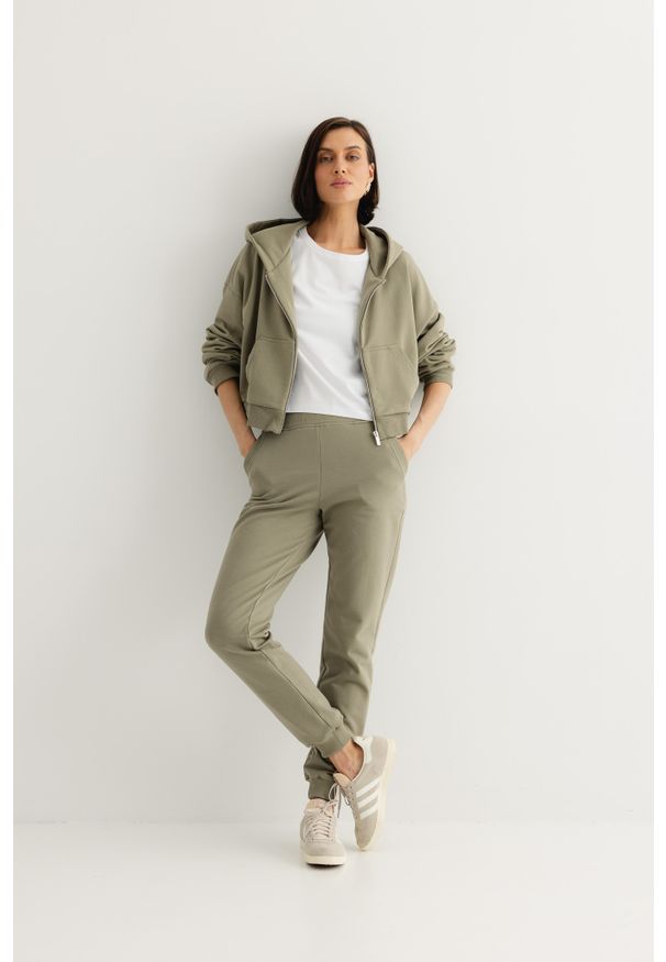 SPODNIE JOGGERS OLIWKA XS - Flawless. Materiał: dresówka, skóra, materiał, bawełna. Długość: długie. Styl: klasyczny, sportowy, elegancki