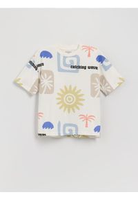 Reserved - T-shirt oversize z nadrukiem - złamana biel. Materiał: bawełna, dzianina. Wzór: nadruk