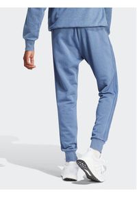 Adidas - adidas Spodnie dresowe ALL SZN 3-Stripes IR5202 Niebieski Regular Fit. Kolor: niebieski. Materiał: bawełna