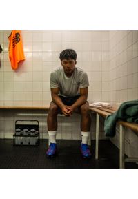 New Balance - Buty piłkarskie Tekela Team Low Laced FG V5. Nosek buta: okrągły. Materiał: mikrofibra, dzianina. Szerokość cholewki: normalna. Sport: piłka nożna