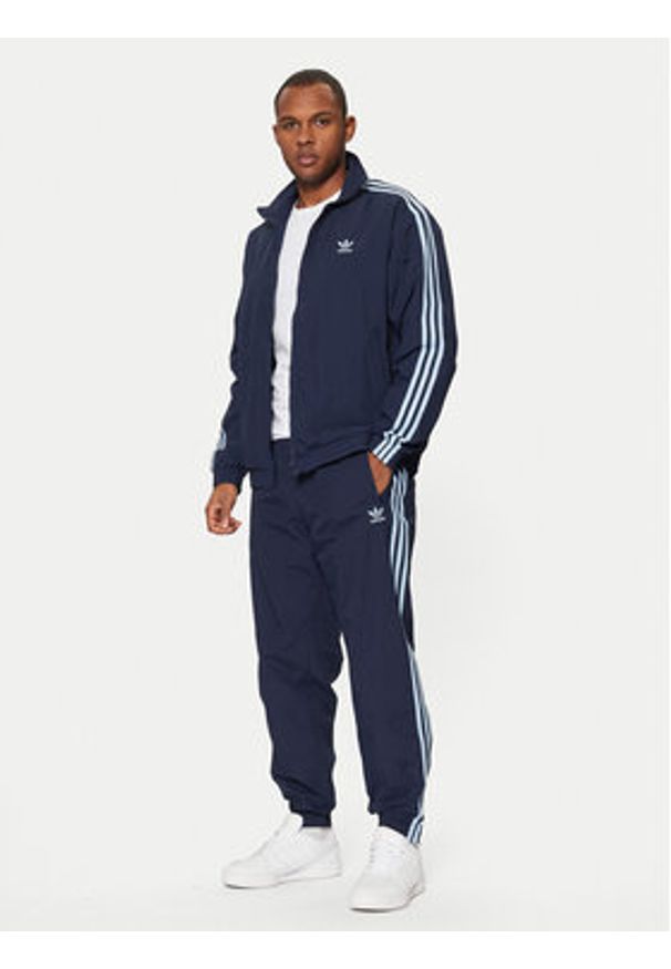 Adidas - adidas Spodnie dresowe adicolor Firebird JP1249 Granatowy Regular Fit. Kolor: niebieski. Materiał: syntetyk