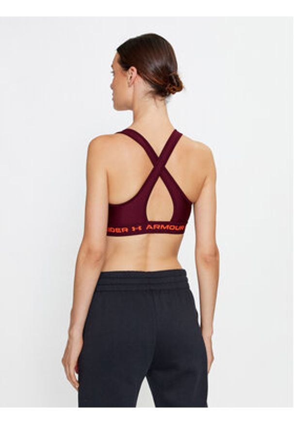 Under Armour Biustonosz sportowy Ua Crossback Mid Bra 1361034 Bordowy Compression Fit. Kolor: czerwony. Materiał: syntetyk