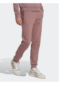 Adidas - adidas Spodnie dresowe adicolor Essentials Trefoil HK0105 Różowy Slim Fit. Kolor: różowy. Materiał: bawełna, dresówka