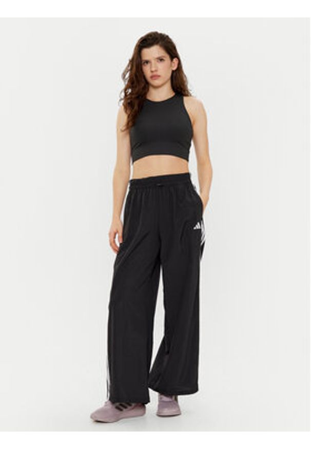 Adidas - adidas Spodnie dresowe Essentials 3-Stripes JE1306 Czarny Loose Fit. Kolor: czarny. Materiał: syntetyk