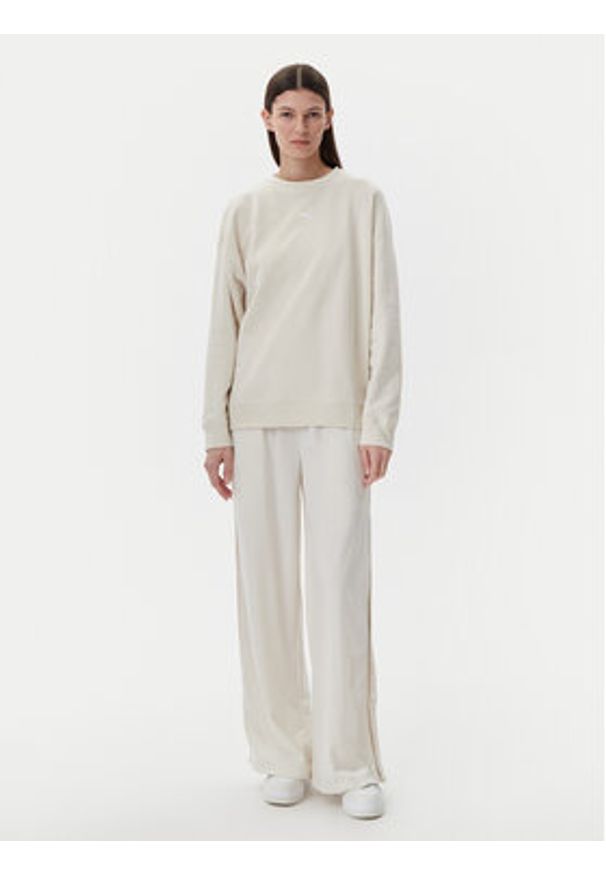 Puma Spodnie dresowe Ess 629804 Beżowy Wide Leg. Kolor: beżowy. Materiał: syntetyk