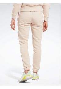Reebok Spodnie dresowe Fleece IC3502 Beżowy Slim Fit. Kolor: beżowy. Materiał: syntetyk #4