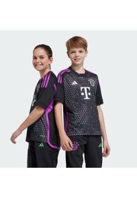 Adidas - Koszulka FC Bayern 23/24 Away Kids. Kolor: różowy, czarny, wielokolorowy. Materiał: materiał