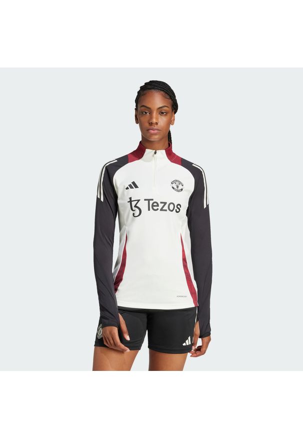 Adidas - Bluza Manchester United Tiro 24 Training. Kolor: czarny, biały, wielokolorowy. Materiał: materiał. Sport: piłka nożna