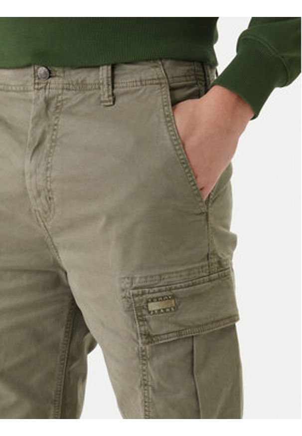 Tommy Jeans Szorty materiałowe Otis DM0DM22831 Zielony Regular Fit. Kolor: zielony. Materiał: bawełna