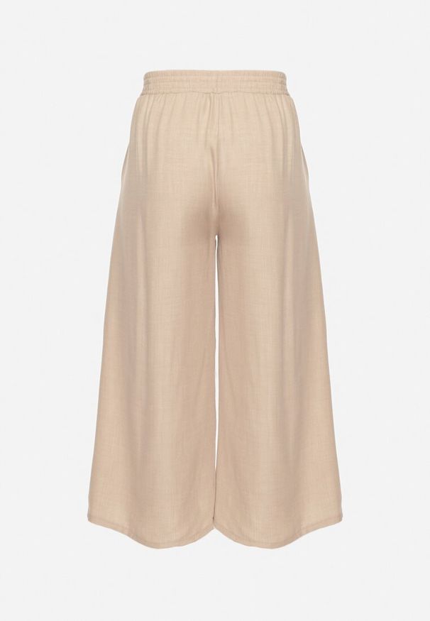 Born2be - Beżowe Spodnie o Szerokim Kroju z Wysokim Stanem i Wiązaniem Telarieta. Okazja: na co dzień. Stan: podwyższony. Kolor: beżowy. Materiał: len. Styl: casual, elegancki, klasyczny