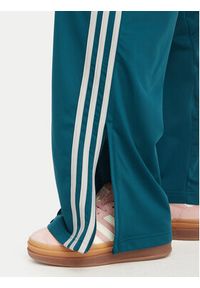 Adidas - adidas Spodnie dresowe Firebird Loose Tracksuit KS4672 Turkusowy Loose Fit. Kolor: turkusowy. Materiał: syntetyk #5