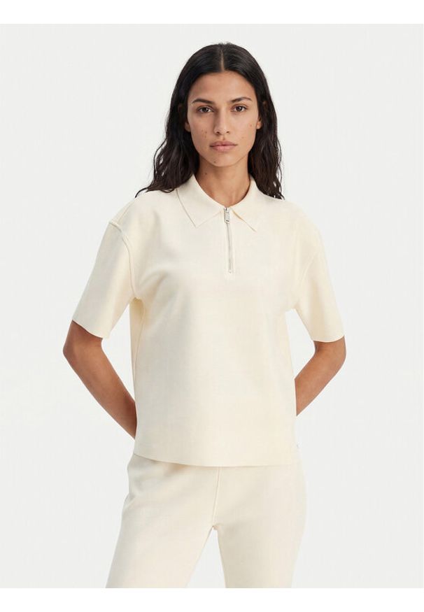 Calvin Klein Polo LV044E241G Beżowy Relaxed Fit. Typ kołnierza: polo. Kolor: beżowy. Materiał: syntetyk