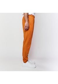 Spodnie do biegania Kappa Costi. Kolor: pomarańczowy. Materiał: dresówka #2