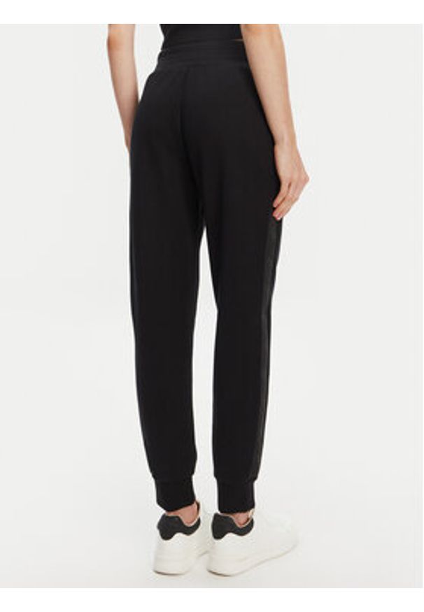 Guess Spodnie dresowe W5YB11 KBYE2 Czarny Regular Fit. Kolor: czarny. Materiał: syntetyk