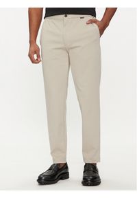 Calvin Klein Spodnie materiałowe K10K113647 Beżowy Comfort Fit. Kolor: beżowy. Materiał: syntetyk