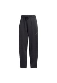 Adidas - Spodnie Essentials Contemporary Logo Fleece Barrel. Kolor: czarny. Materiał: polar, materiał. Sport: fitness