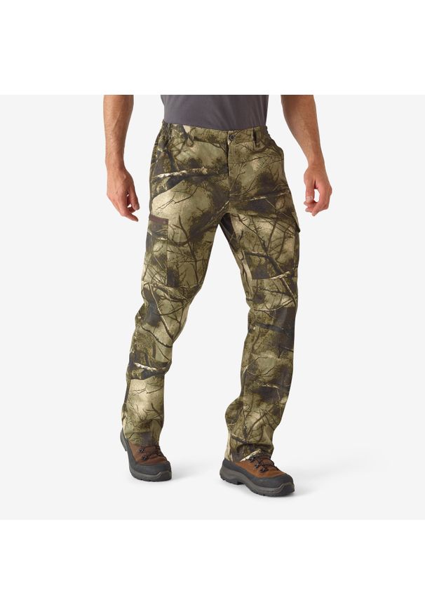 SOLOGNAC - Spodnie myśliwskie Solognac 100 Respi camo treemetic. Kolor: zielony, brązowy, wielokolorowy. Materiał: bawełna, poliester, materiał. Sport: outdoor