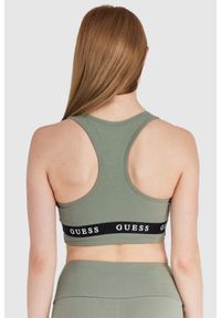 Guess - GUESS Zielony top sportowy damski z logo, Rozmiar L. Kolor: zielony. Materiał: bawełna. Styl: sportowy