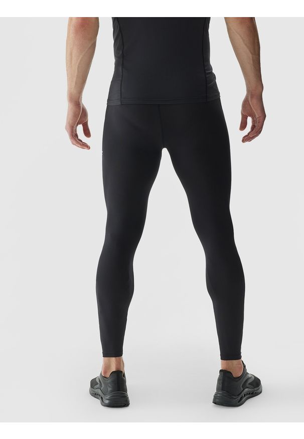 4f - 4F Legginsy treningowe ze średnim stanem męskie - czarne L. Kolor: czarny. Materiał: dzianina, włókno, poliester, materiał, elastan. Wzór: gładki, ze splotem, jednolity. Sport: fitness