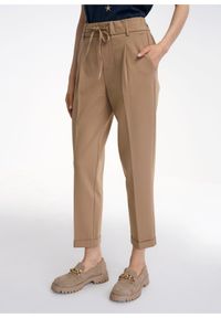 Ochnik - Beżowe spodnie z kantem damskie. Kolor: beżowy. Materiał: materiał. Styl: elegancki #1