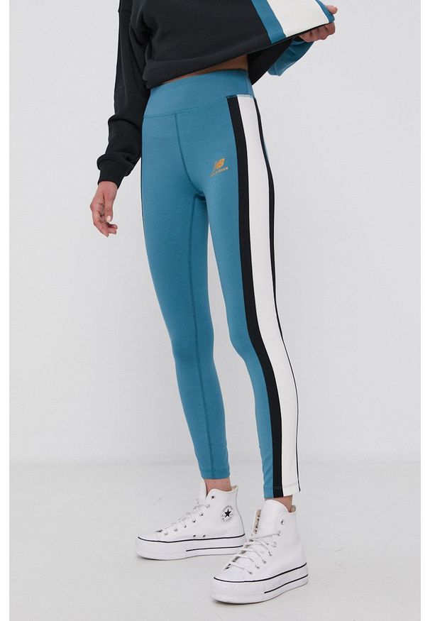 New Balance Legginsy damskie kolor turkusowy z aplikacją. Stan: podwyższony. Kolor: turkusowy. Materiał: dzianina. Wzór: aplikacja