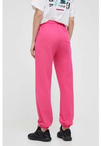 Champion spodnie dresowe kolor różowy gładkie. Kolor: różowy. Materiał: dresówka. Wzór: gładki #2