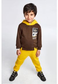 Mayoral spodnie dresowe dziecięce kolor żółty gładkie. Kolor: żółty. Materiał: dresówka. Wzór: gładki