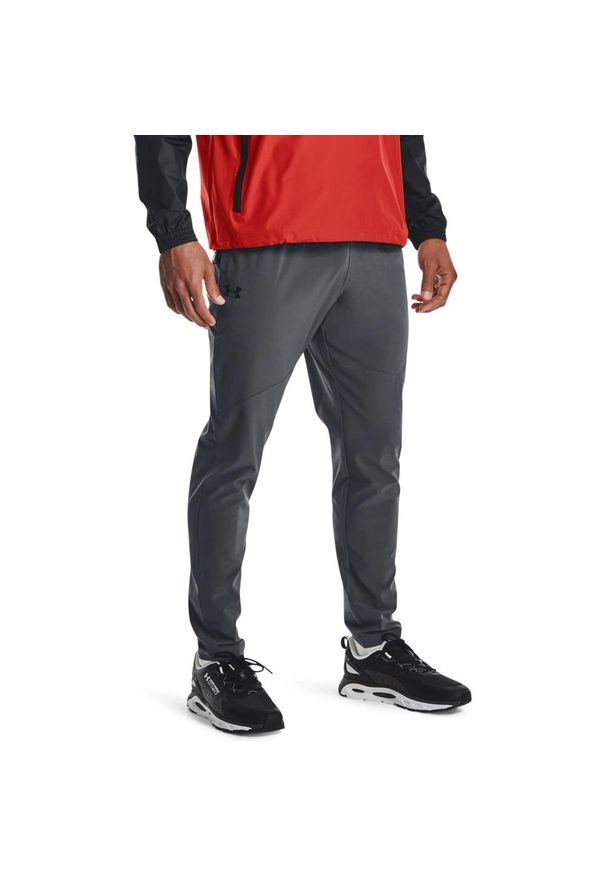 Spodnie dresowe męskie Under Armour STRETCH WOVEN PANT. Kolor: szary. Materiał: dresówka