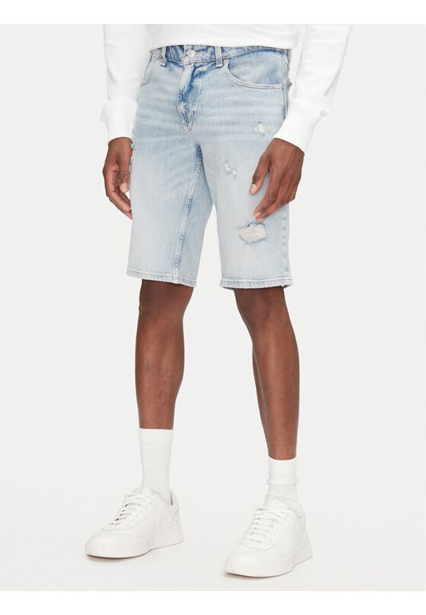 Tommy Jeans Szorty jeansowe Ronnie DM0DM21300 Niebieski Regular Fit. Kolor: niebieski. Materiał: bawełna