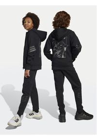 Adidas - adidas Spodnie dresowe Star Wars The Mandalorian™ JF3635 Czarny Regular Fit. Kolor: czarny. Materiał: bawełna. Wzór: motyw z bajki #3
