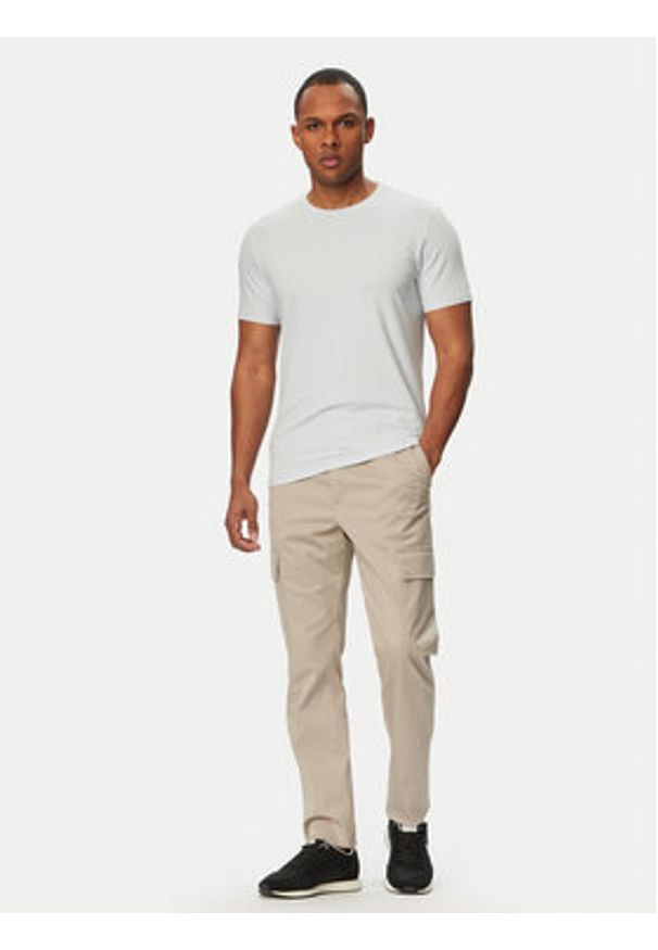 Calvin Klein Spodnie cargo LV04LC619G Beżowy Slim Fit. Kolor: beżowy. Materiał: bawełna
