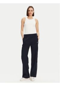 Lacoste Spodnie dresowe XF7260 Granatowy Relaxed Fit. Kolor: niebieski. Materiał: syntetyk, bawełna #4