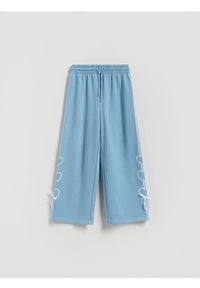 Reserved - Spodnie dresowe z kokardkami - jasnoturkusowy. Kolor: turkusowy. Materiał: dresówka