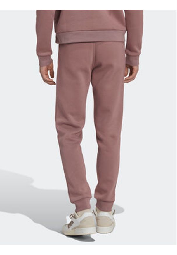 Adidas - adidas Spodnie dresowe adicolor Essentials Trefoil HK0105 Różowy Slim Fit. Kolor: różowy. Materiał: dresówka, bawełna