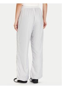Puma Spodnie dresowe PUMA X ROSÉ T7 633796 32 Srebrny Relaxed Fit. Kolor: srebrny. Materiał: syntetyk #5