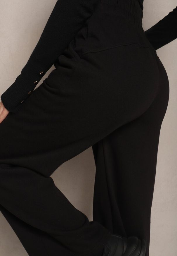 Renee - Czarne Spodnie Dresowe High Waist z Bawełny z Szerokimi Nogawkami i Polarową Wyściółką Senilora. Stan: podwyższony. Kolor: czarny. Materiał: dresówka, polar, bawełna. Styl: sportowy, elegancki