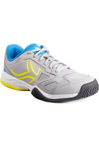 ARTENGO - Buty tenisowe TS560 dla dzieci. Kolor: niebieski, wielokolorowy, żółty, szary. Materiał: tkanina, mesh, kauczuk. Szerokość cholewki: szeroka. Sport: tenis #1