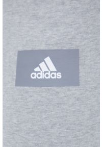 Adidas - adidas spodnie dresowe bawełniane HE4341 męskie kolor szary melanżowe. Kolor: szary. Materiał: dresówka, bawełna. Wzór: melanż