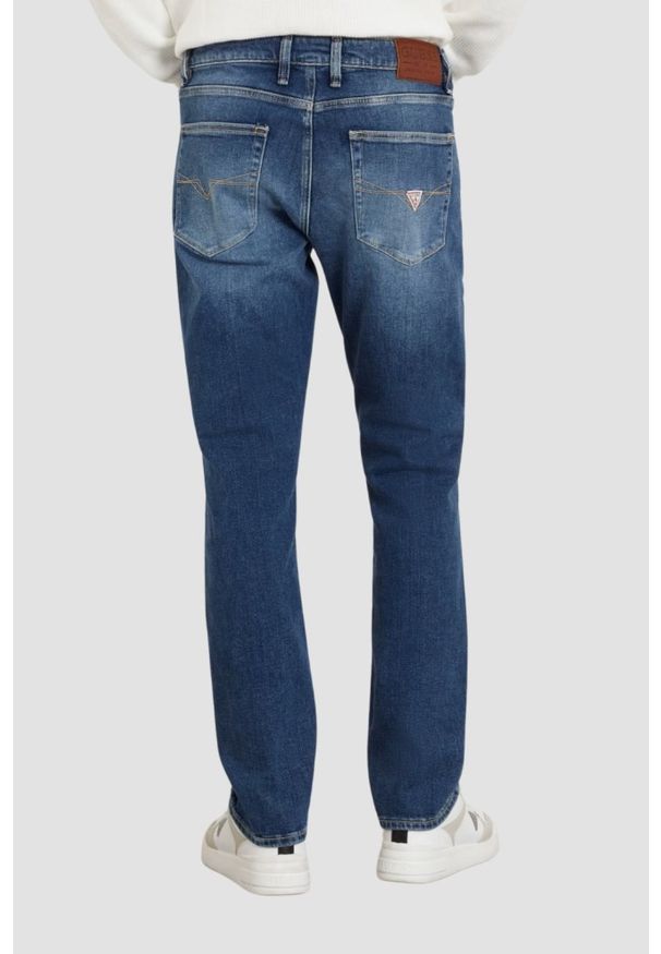Guess - GUESS Granatowe męskie spodnie jeansowe Angels. Kolor: niebieski