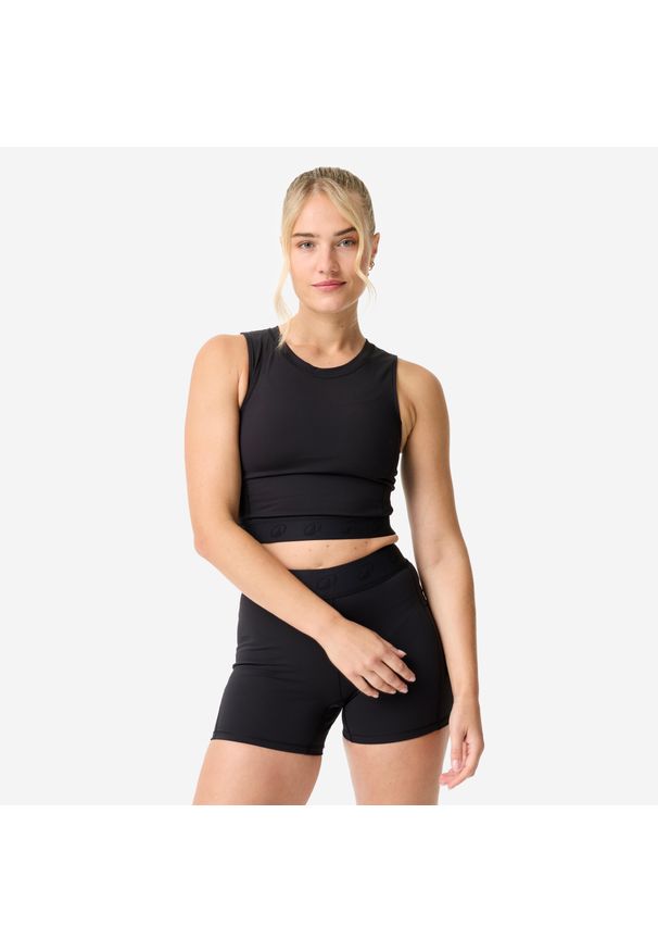 DOMYOS - Koszulka fitness damska Domyos crop top. Kolor: czarny. Materiał: elastan, poliamid, materiał. Długość: krótkie. Sport: fitness