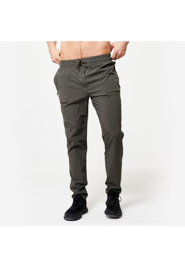 DOMYOS - Spodnie fitness męskie Domyos. Kolor: wielokolorowy, zielony, brązowy. Materiał: materiał, poliester, elastan. Sport: fitness